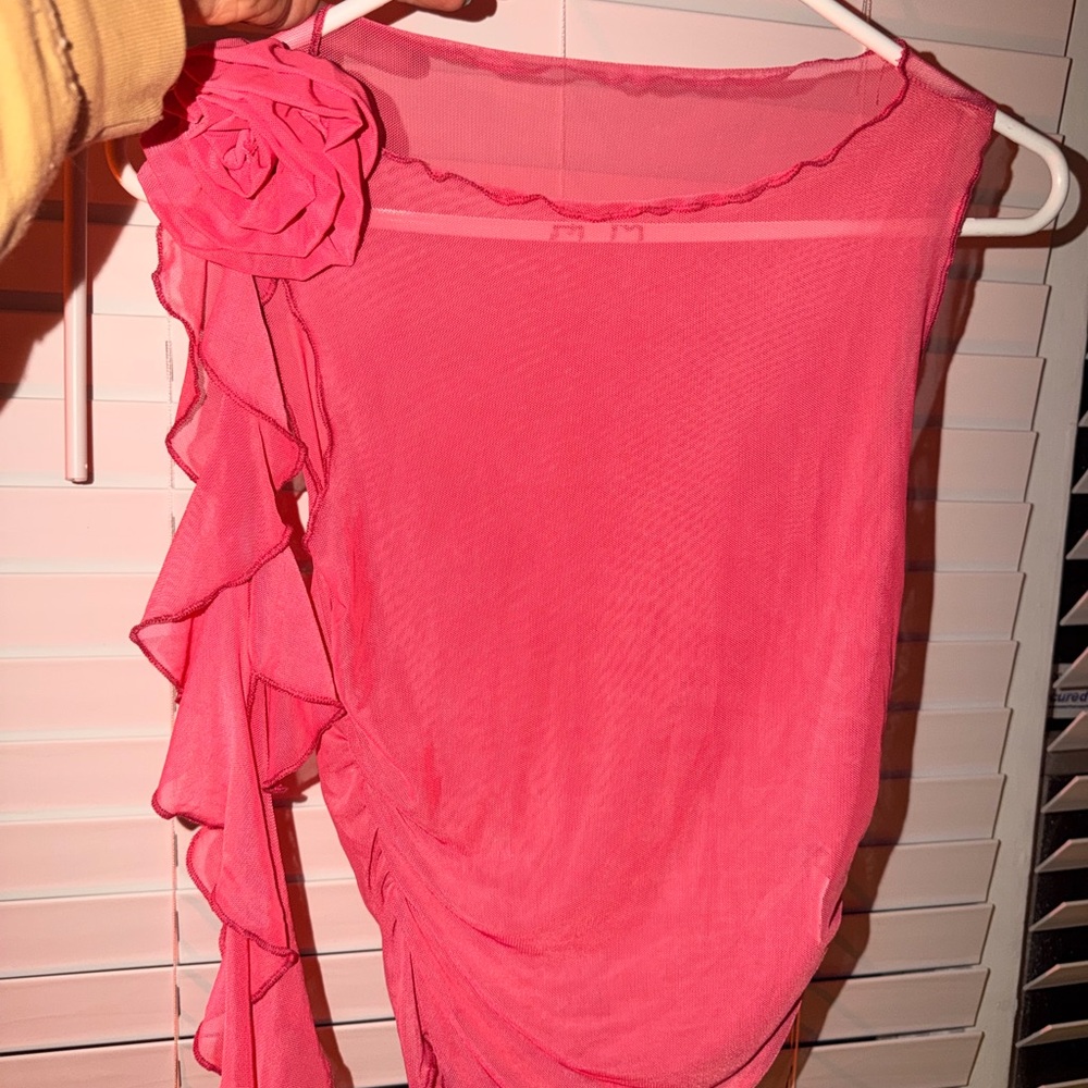 Chic Pink Sleeveless Top with Ruffle Detail see through